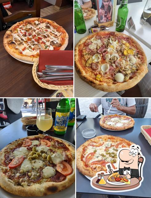 Scegli una pizza a Picerija Briksen
