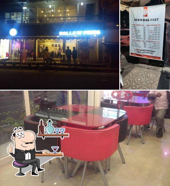 Take a seat at one of the tables at Rolls N Fries