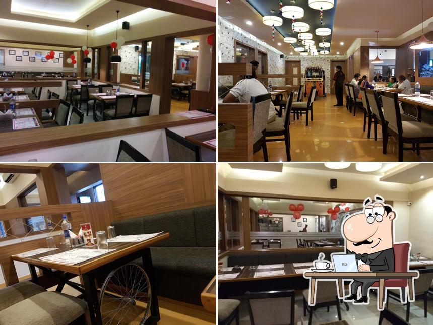 Take a seat at one of the tables at Alibaba & 41 Dishes - Trivandrum