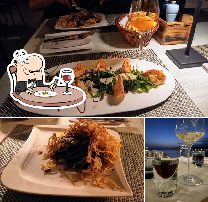 Guarda la foto che presenta la cibo e bevanda di Restoran - Pizzeria Spadici