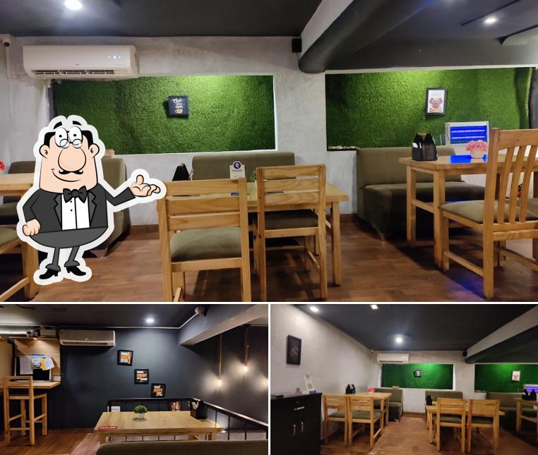Take a seat at one of the tables at Pathsala Café Goa