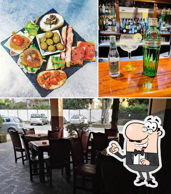 Dai un'occhiata agli interni di Bar Family Ink