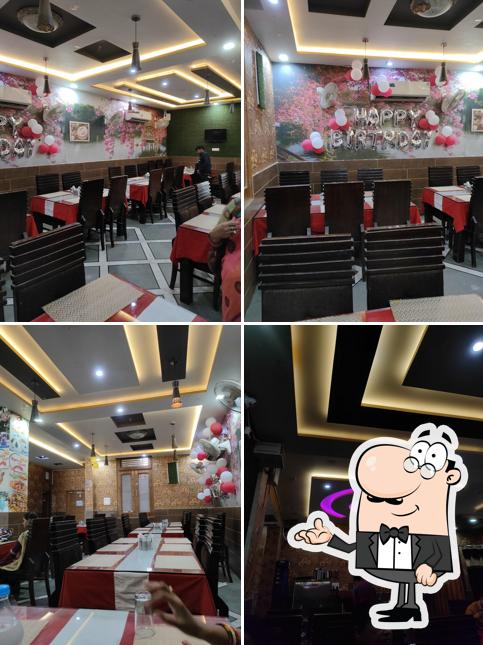 Take a seat at one of the tables at Spicy Treat restaurant