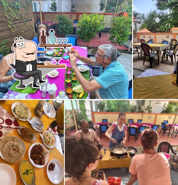 Take a seat at one of the tables at Suprabhatham Pure Vegetarian Restaurant