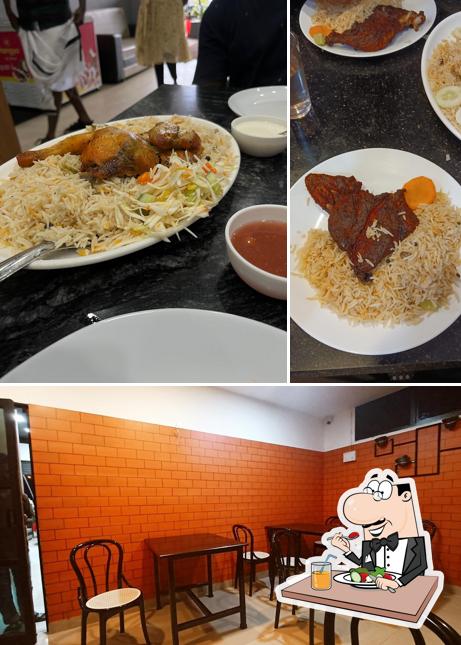 Take a look at the photo displaying food and interior at Mandi Palace