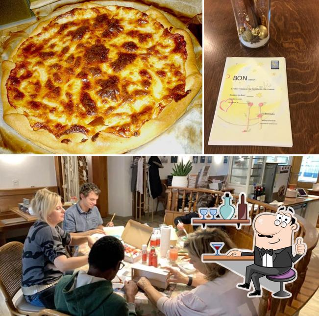 Questa è la foto che mostra la interni e pizza di Demi-Lune