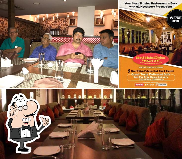 Take a seat at one of the tables at Moti Mahal Delux Tandoori Trail