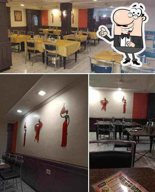 Take a seat at one of the tables at Kovai Virundhu