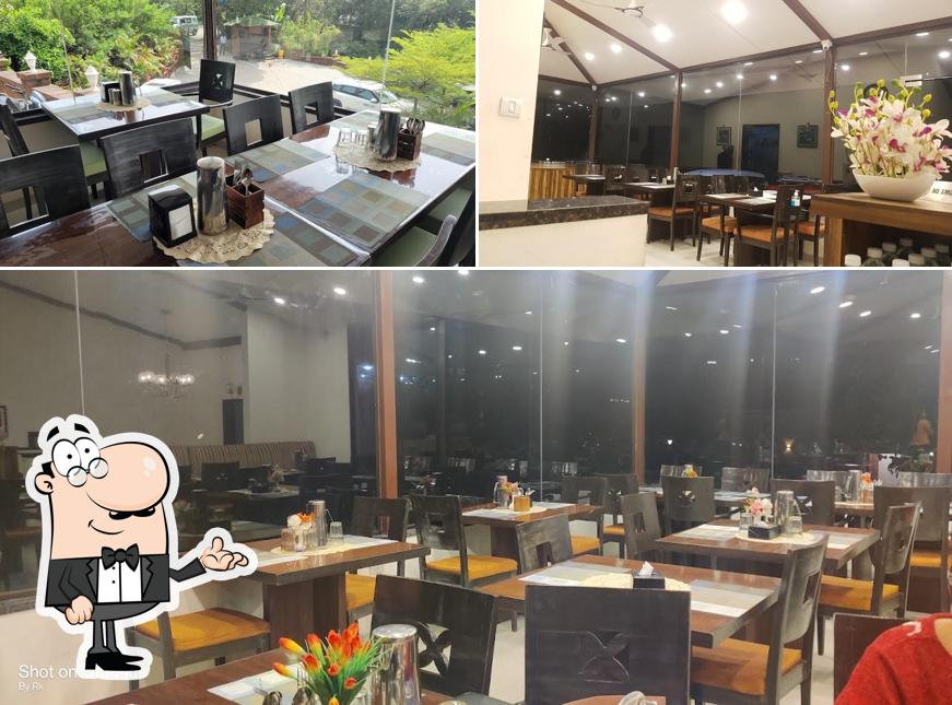 Take a seat at one of the tables at A food Affair Resto Mahabaleshwar