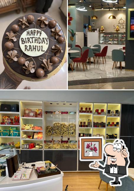 Take a seat at one of the tables at SMOOR Cafe - Seawoods