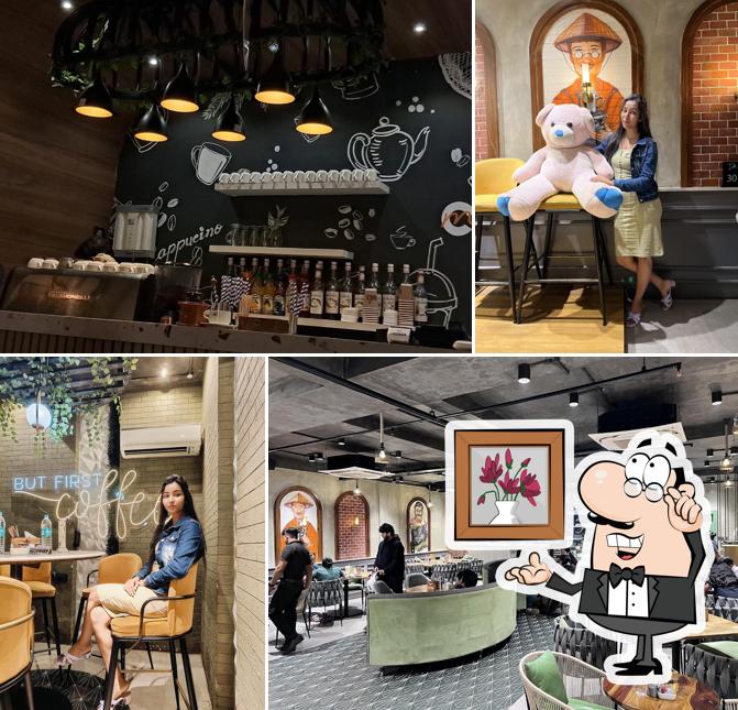 Take a seat at one of the tables at Bigcup Cafe Sum Outlet