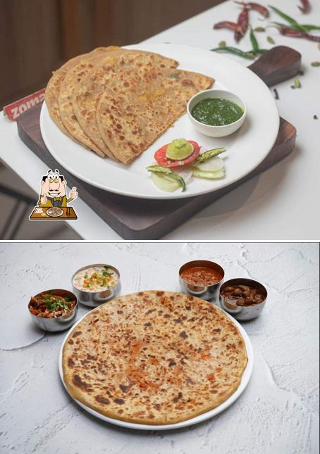 Get pizza at The Paratha Spot