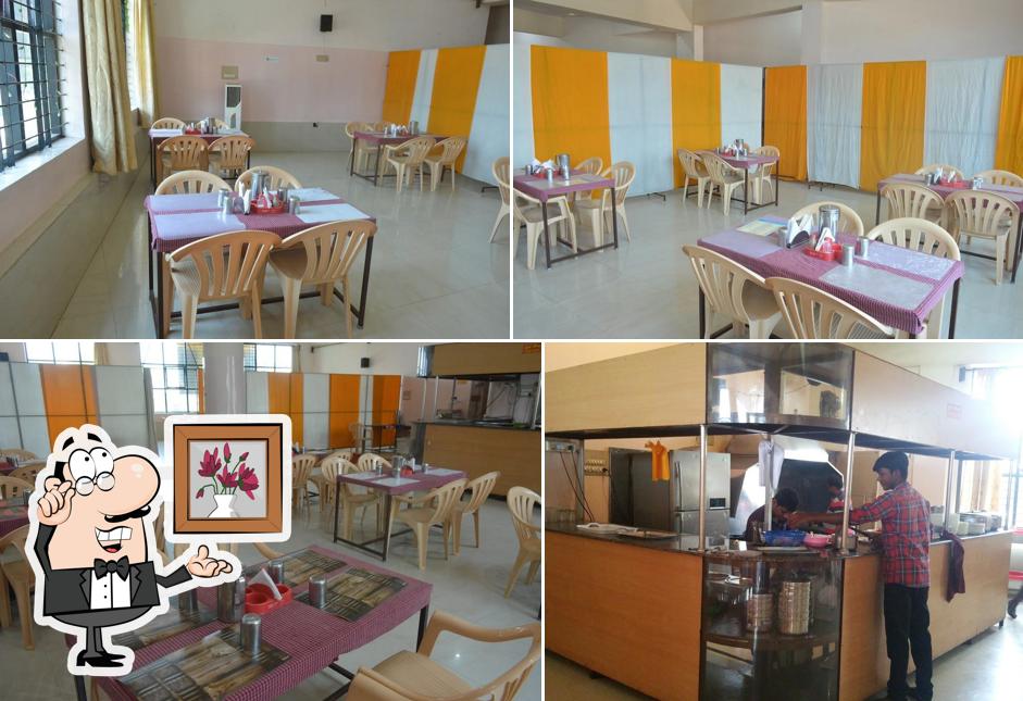 Take a seat at one of the tables at BALAJI FAMILY RESTAURANT