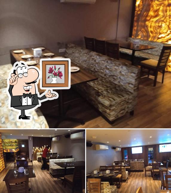 Take a seat at one of the tables at QJ Restaurant and Bar