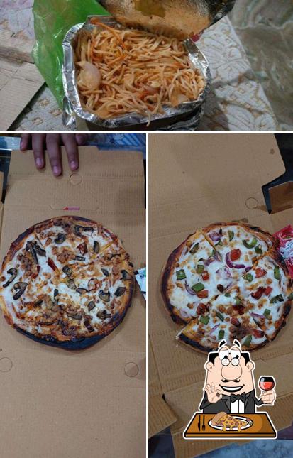 Pick pizza at Blue Moon Restaurant