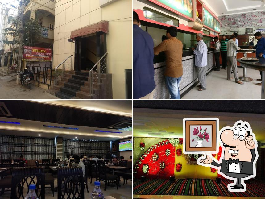 Take a seat at one of the tables at Hotel Sindhura EastCourt