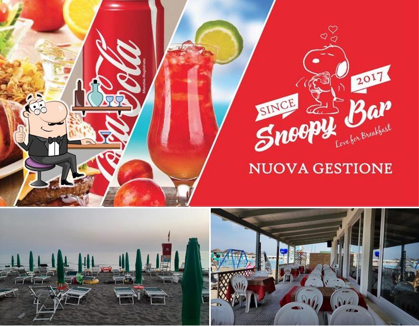 Dai un’occhiata alla immagine che mostra la interni e bevanda di Snoopy Pizza & Burger Bar