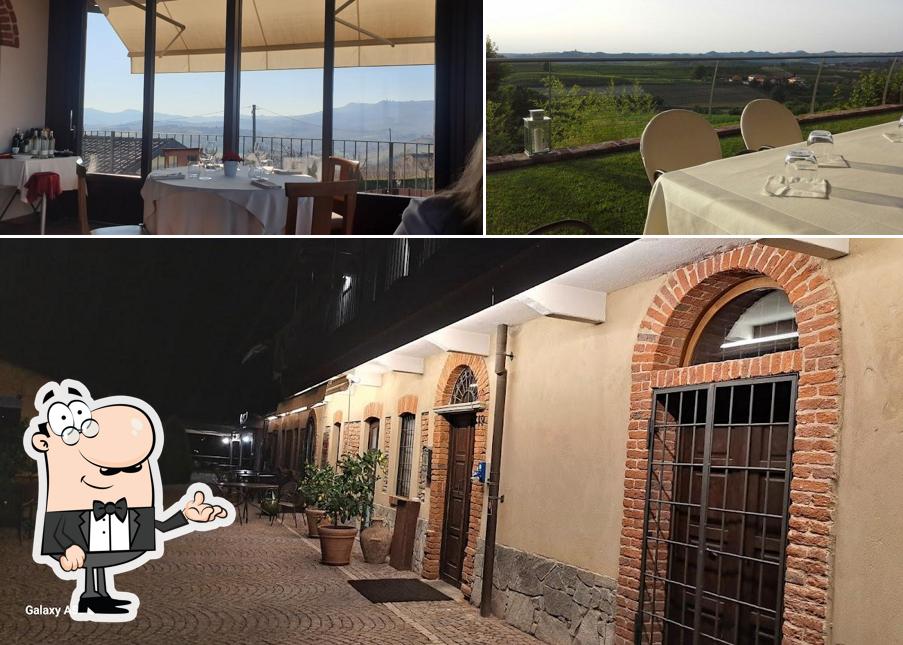 Guarda la immagine che raffigura la interni e tavolo da pranzo di Ristorante con Camere Il Vigneto di Roddi