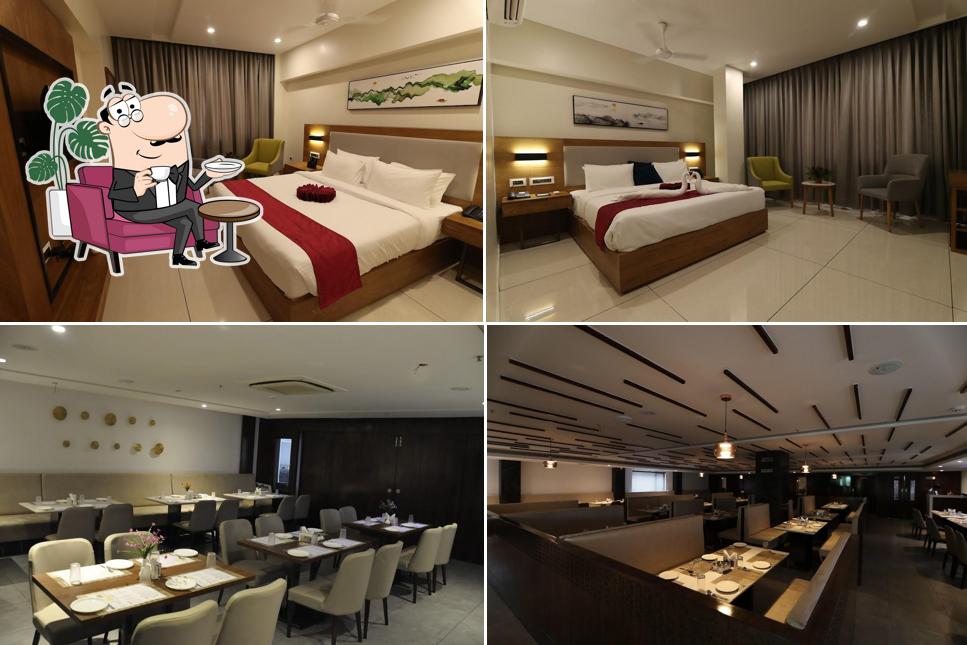 Take a seat at one of the tables at Sri Sri Sri Hotel