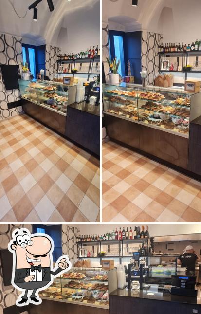 Questa è la foto che presenta la interni e cibo di Baratiè