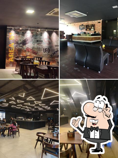 Take a seat at one of the tables at Area 51 - The café hideout