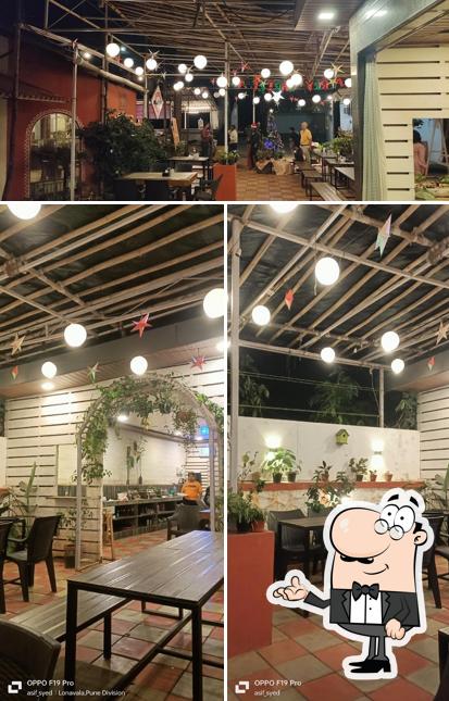 Take a seat at one of the tables at PAANI TO PURI STATION