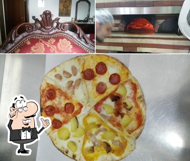 Guarda la foto che mostra la interni e pizza di Pizzeria da Pietro