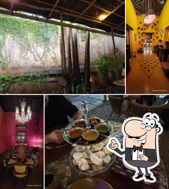 Take a seat at one of the tables at Jamun Goa