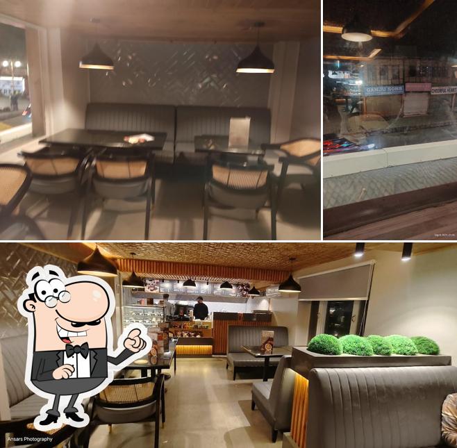 Take a seat at one of the tables at Barista Cafe Pahalgam