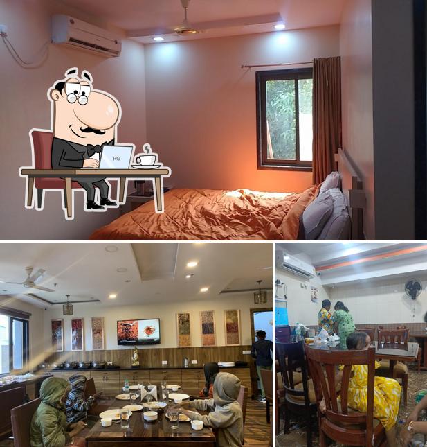 Take a seat at one of the tables at Hotel Sheetal Family Restaurant (Veg /Non-Veg)