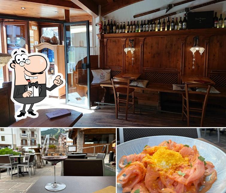 Questa è la foto che raffigura la interni e cibo di Enoteca Baita Fraina