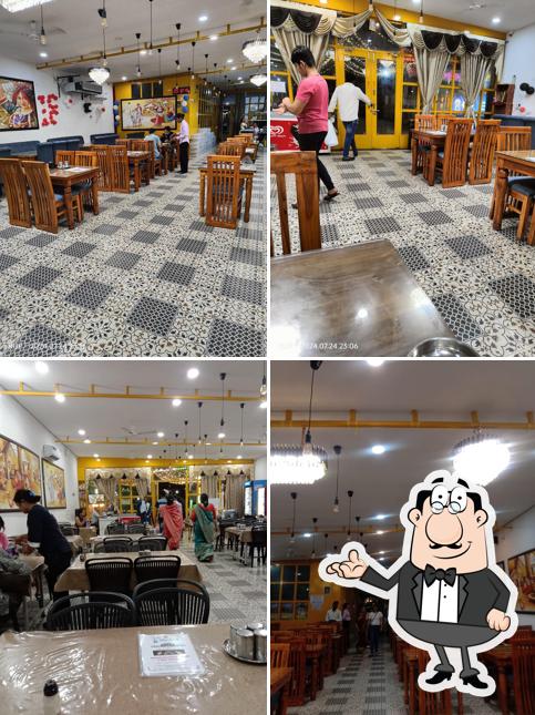 Take a seat at one of the tables at Rajwada Rajasthani Dhaba & Thali Restaurant
