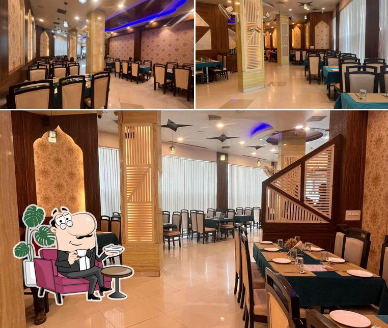 Take a seat at one of the tables at The Biryani Palace