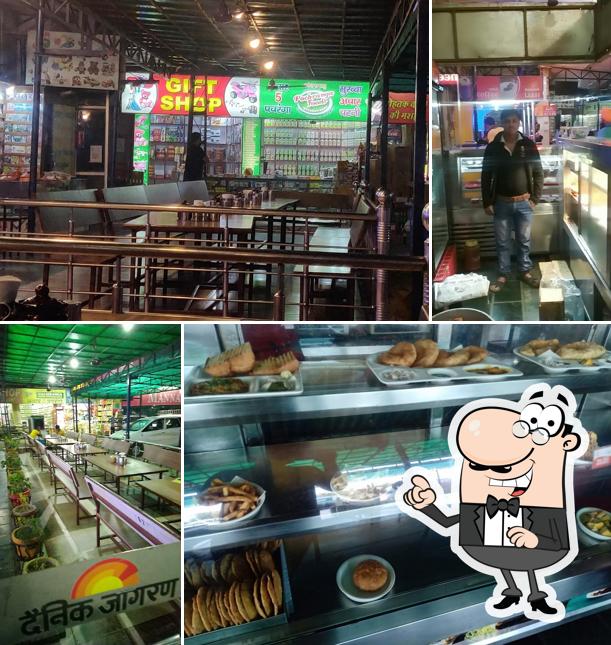 Take a seat at one of the tables at Mannat Dhaba Rohtak