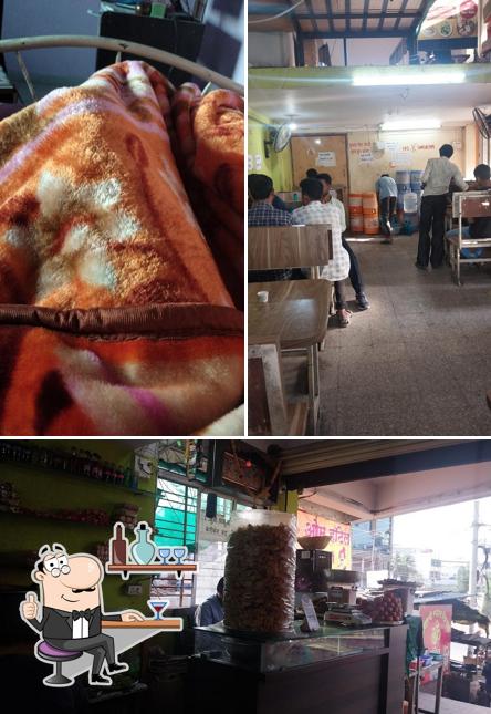 Take a look at the image displaying interior and food at Kandhar Khichadi