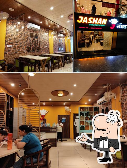 Take a seat at one of the tables at jashan family restaurant