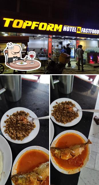 Check out the image displaying food and interior at Top Form Hotel