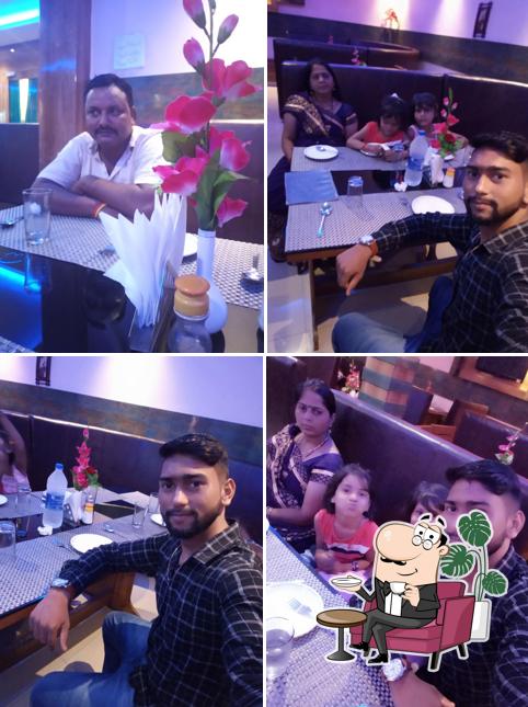 Take a seat at one of the tables at Van Bhojan Restaurant