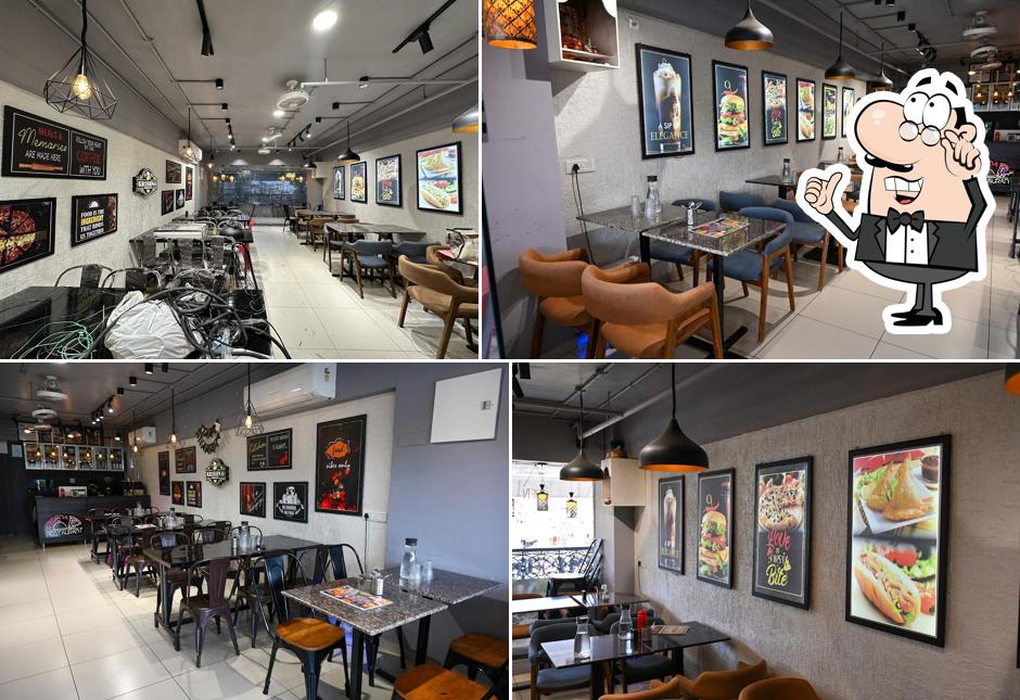 Take a seat at one of the tables at Krishna Restaurant and Cafe