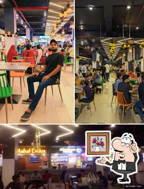 Take a seat at one of the tables at Food Court