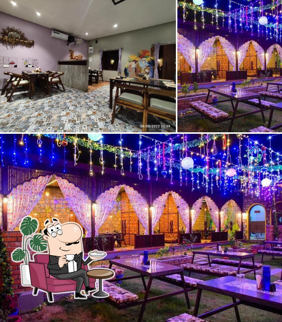 Take a seat at one of the tables at The Lalit Cafe & Restaurant, Balotra