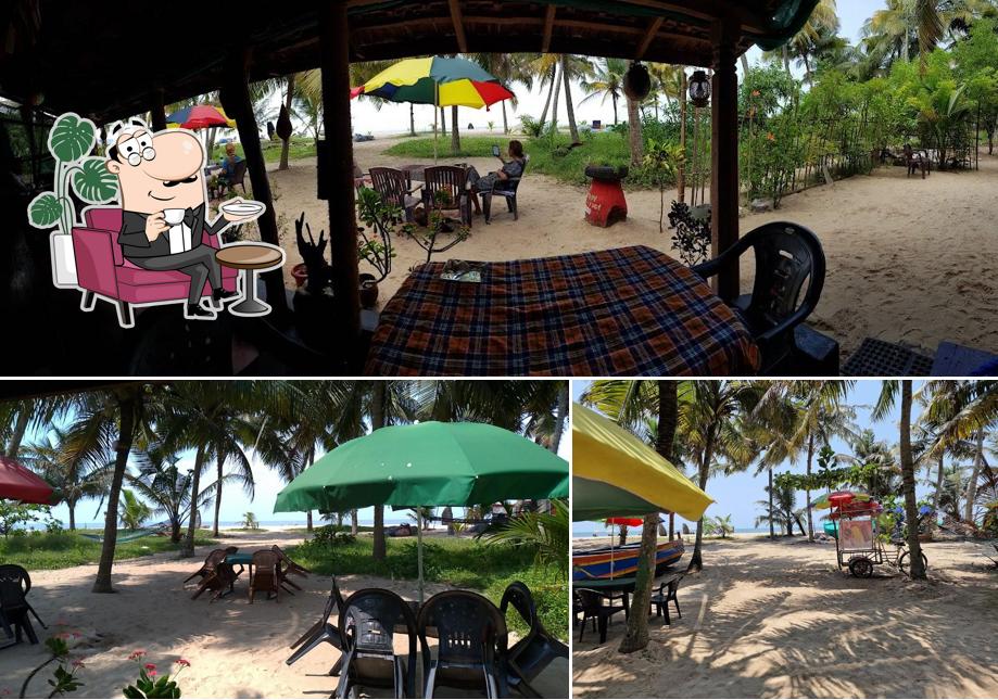 Take a seat at one of the tables at Palm Heaven Marari Homely Seafood