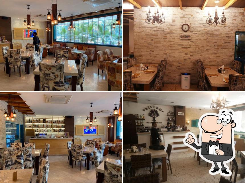 Take a seat at one of the tables at REBOOT By Bistro Flamme Bois - Pakhowal Road