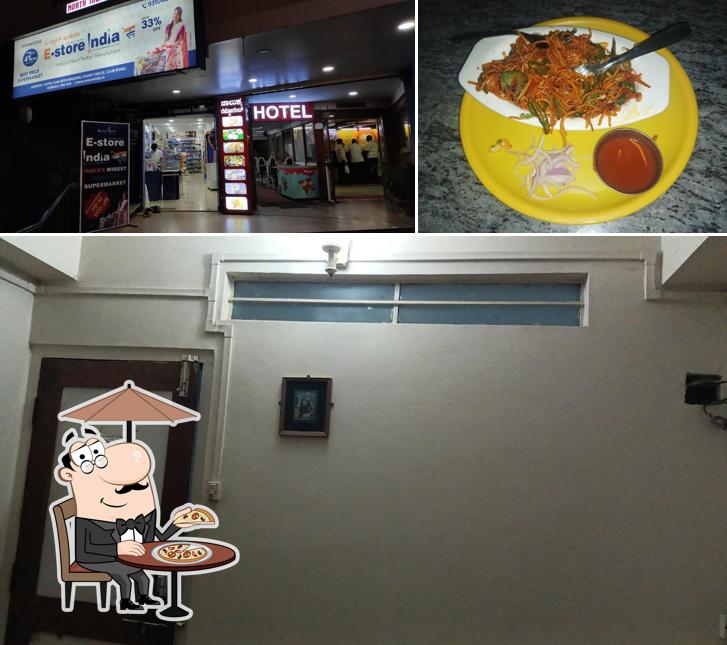 The photo of exterior and food at Chalukya Residency & Hotel