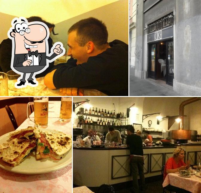 Siediti a un tavolo di Coke Pizzeria