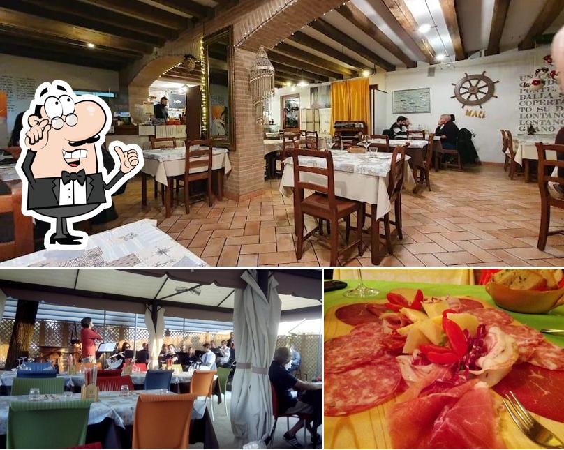 La immagine di interni e cibo da Trattoria alla Pesa