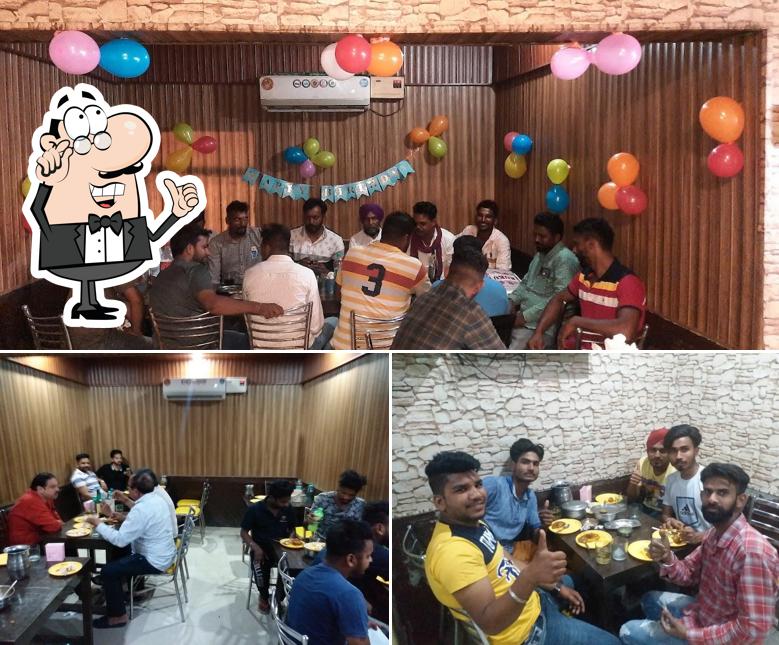 Check out the picture displaying interior and food at Anand Dhaba