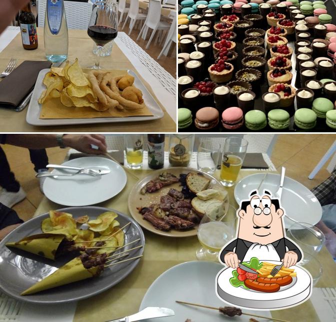Tra le varie cose da Hotel Olimpia si possono trovare la cibo e tavolo da pranzo