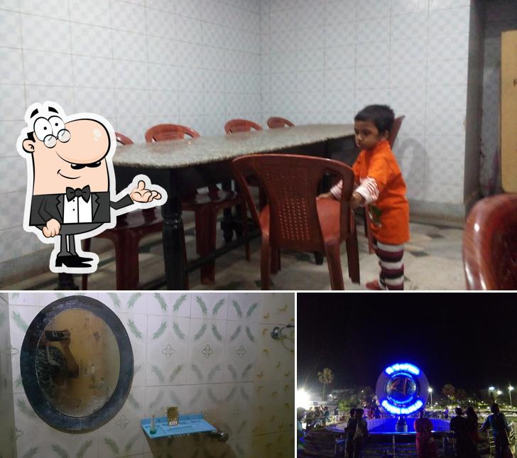 Take a seat at one of the tables at Purbasha Hotel & Restaurant