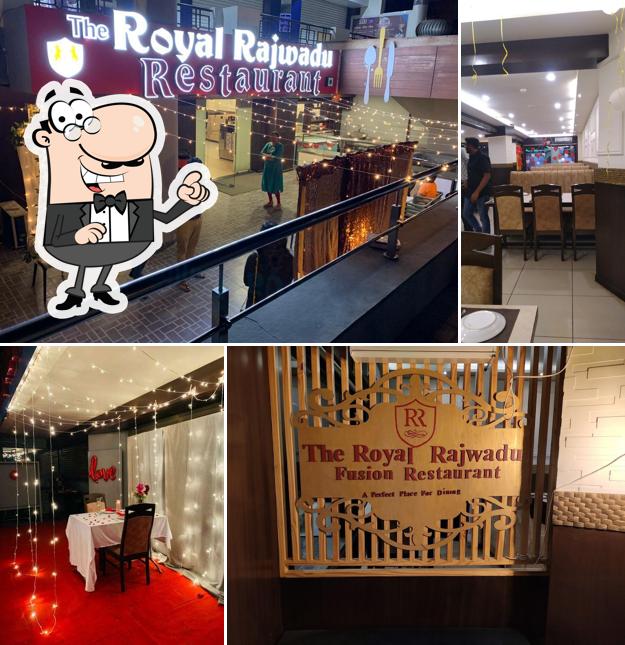 Take a seat at one of the tables at The Royal Rajwadu Restaurant